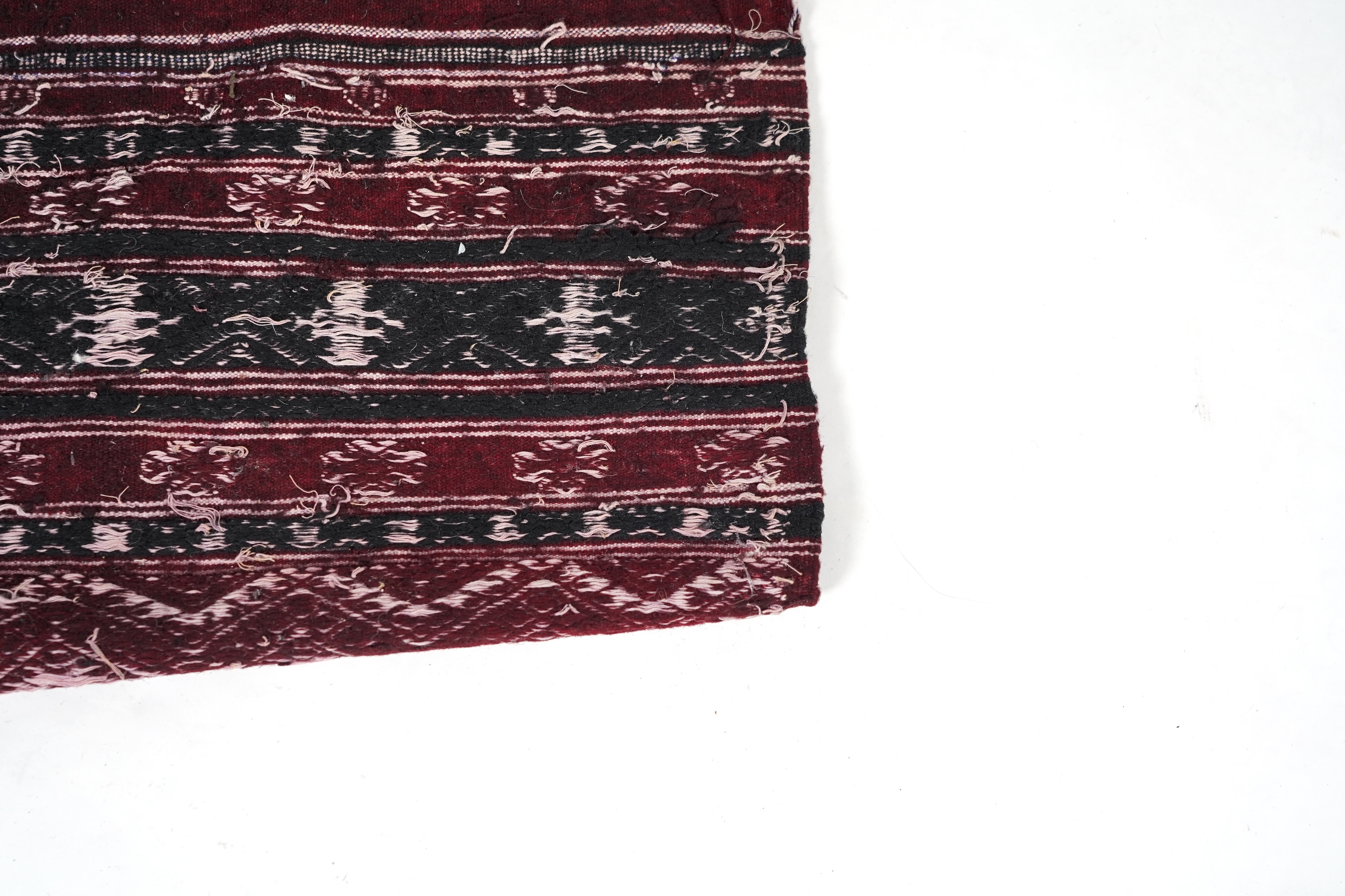 A Tunisian Amazigh, Berber maroon and white woven wool wall hanging, possibly 107 x 125cm